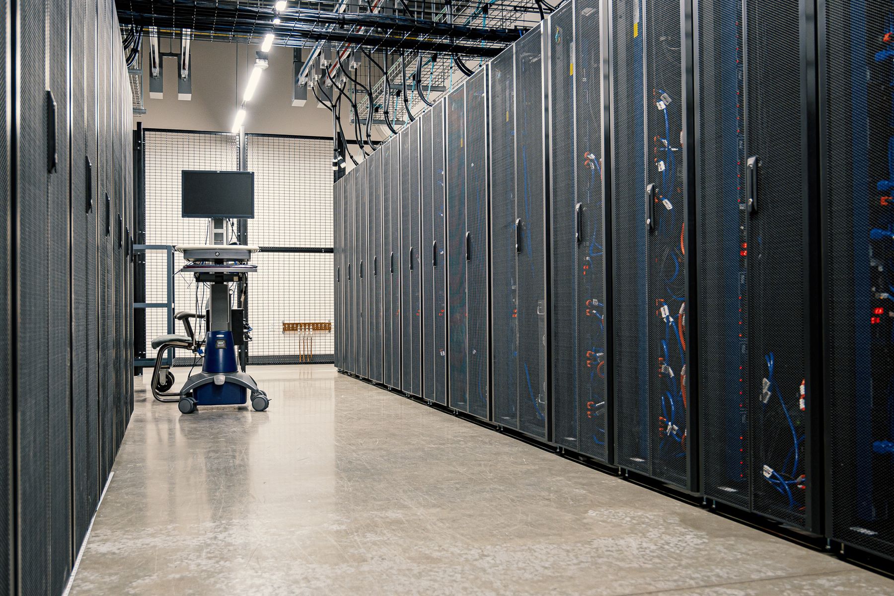 Server racks in a data center. Stock photograph, not a SAINT facility.